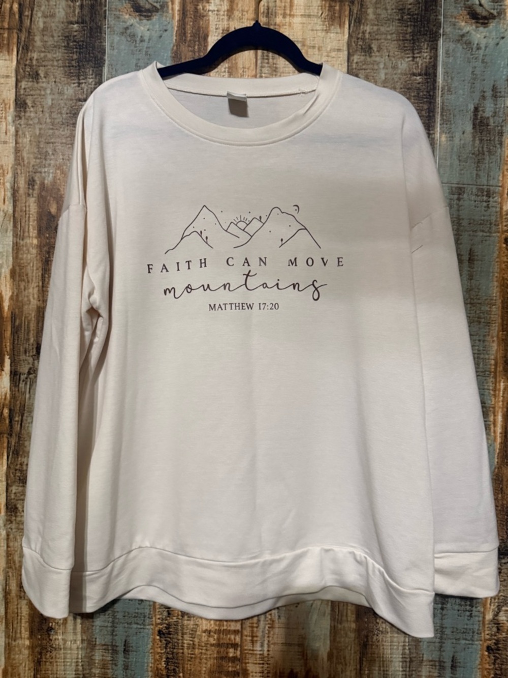 Faith Can Move Mountains Cream Graphic Pullover Top